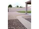 Spacious backyard with an extended patio and a mixture of brick and gravel landscaping at 488 W Harvard Ave, Gilbert, AZ 85233