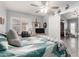 Bright bedroom with ceiling fan, closet, and view to another room at 5221 W Garden Dr, Glendale, AZ 85304