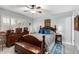 Charming bedroom with wood accents, stylish bedding, and bright lighting at 5221 W Garden Dr, Glendale, AZ 85304