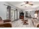 Open-concept living room leading into the dining area with lots of natural light at 5221 W Garden Dr, Glendale, AZ 85304