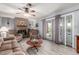 Spacious living room features fireplace and glass doors leading to patio at 5221 W Garden Dr, Glendale, AZ 85304