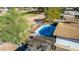 Aerial view of a house with a fenced pool and cabana near a golf course at 544 W Thunderbird Rd, Phoenix, AZ 85023