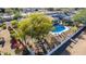 Aerial view of a home featuring a backyard oasis complete with a sparkling pool and mature trees at 544 W Thunderbird Rd, Phoenix, AZ 85023