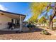 A backyard features a covered patio, desert landscaping, and a refreshing pool, perfect for outdoor living at 544 W Thunderbird Rd, Phoenix, AZ 85023