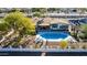 Aerial view of a backyard with a refreshing pool, lounge chairs, and a charming pergola at 544 W Thunderbird Rd, Phoenix, AZ 85023