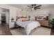 Bright bedroom featuring a modern ceiling fan, stylish decorations, and light-colored walls for a calming atmosphere at 544 W Thunderbird Rd, Phoenix, AZ 85023