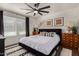 Inviting bedroom with dark wood details, decorative pillows, and a patterned rug for a cozy and stylish retreat at 544 W Thunderbird Rd, Phoenix, AZ 85023