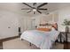 Bright bedroom featuring a modern ceiling fan, stylish decorations, and light-colored walls for a calming atmosphere at 544 W Thunderbird Rd, Phoenix, AZ 85023
