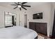 Stylish bedroom features a sleek television, decorative dresser, and neutral walls for a calming and contemporary retreat at 544 W Thunderbird Rd, Phoenix, AZ 85023