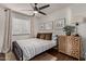 Inviting bedroom with patterned rug, decorative dresser, and neutral walls for a calming and cozy retreat at 544 W Thunderbird Rd, Phoenix, AZ 85023