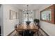 Elegant dining room boasts a rustic table, backyard view, and stylish decor at 544 W Thunderbird Rd, Phoenix, AZ 85023