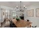 Bright dining room features rustic wood table, stylish chandelier, and easy access to other rooms at 544 W Thunderbird Rd, Phoenix, AZ 85023