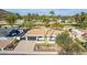 Beautiful single-story home featuring a well-manicured front yard and proximity to a lush green golf course at 544 W Thunderbird Rd, Phoenix, AZ 85023