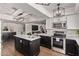 Well-appointed kitchen with modern appliances, white countertops and dark wood cabinets at 544 W Thunderbird Rd, Phoenix, AZ 85023