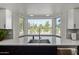 The kitchen features a great view, a modern sink, and updated lighting at 544 W Thunderbird Rd, Phoenix, AZ 85023
