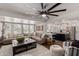 Comfortable living room with sofa, armchairs, and seamless access to the kitchen at 544 W Thunderbird Rd, Phoenix, AZ 85023