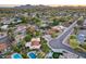 Picturesque aerial shot showcasing the neighborhood, private backyard pools, and manicured landscaping at 5975 E Larkspur Dr, Scottsdale, AZ 85254