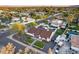 Lovely aerial view of a well-maintained property with pool, gazebo, and putting green amidst lush greenery and a serene neighborhood at 5975 E Larkspur Dr, Scottsdale, AZ 85254