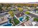 Gorgeous aerial view showcasing the home's sparkling pool, lush landscaping, and putting green at 5975 E Larkspur Dr, Scottsdale, AZ 85254