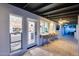 The back patio offers bar seating, access to indoor dining room and kitchen, plus lush backyard views at 5975 E Larkspur Dr, Scottsdale, AZ 85254