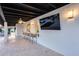 Spacious back patio with a covered area, bar seating and a television at 5975 E Larkspur Dr, Scottsdale, AZ 85254