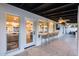 Extended outdoor patio with bar seating and pass through window into the kitchen at 5975 E Larkspur Dr, Scottsdale, AZ 85254