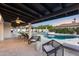 Gorgeous outdoor living space offers a covered patio, beautiful pool, and lounge chairs for relaxing and enjoying the weather at 5975 E Larkspur Dr, Scottsdale, AZ 85254