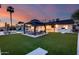 Expansive backyard with lush turf, elegant gazebo and lounge area perfect for outdoor entertainment at 5975 E Larkspur Dr, Scottsdale, AZ 85254