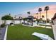 Gorgeous outdoor living space offers a covered patio, beautiful pool, and lounge chairs for relaxing and enjoying the weather at 5975 E Larkspur Dr, Scottsdale, AZ 85254