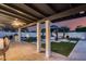 This amazing covered patio with seating, outdoor kitchen and lush green grass provides the perfect entertaining space at 5975 E Larkspur Dr, Scottsdale, AZ 85254