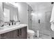 Contemporary bathroom with a glass-enclosed shower and elegant vanity at 5975 E Larkspur Dr, Scottsdale, AZ 85254