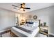 Relaxing bedroom with ceiling fan, ensuite walk-in closet, and modern decor at 5975 E Larkspur Dr, Scottsdale, AZ 85254