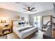 Modern bedroom featuring a ceiling fan, sliding glass doors, and stylish decor at 5975 E Larkspur Dr, Scottsdale, AZ 85254