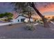 Charming single-story home with a garage and well-maintained landscaping in a peaceful neighborhood at 5975 E Larkspur Dr, Scottsdale, AZ 85254