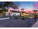Beautiful home exterior with a lush front lawn, well-manicured landscaping, and a paved walkway at 5975 E Larkspur Dr, Scottsdale, AZ 85254