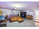 Finished garage with game machines, couch, and an epoxy-coated floor at 5975 E Larkspur Dr, Scottsdale, AZ 85254