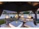 Comfortable gazebo with cushioned seating and decorative pillows creates a cozy outdoor retreat at 5975 E Larkspur Dr, Scottsdale, AZ 85254