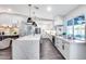 Bright kitchen features a central island, stainless steel appliances, and large windows at 5975 E Larkspur Dr, Scottsdale, AZ 85254