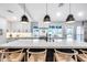 Modern kitchen boasts waterfall island, stainless appliances, and a bright, airy design at 5975 E Larkspur Dr, Scottsdale, AZ 85254