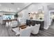 Stylish living area with a wet bar, seating area, and views of the dining room at 5975 E Larkspur Dr, Scottsdale, AZ 85254