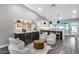 Inviting living room with bar, modern furniture, and kitchen area at 5975 E Larkspur Dr, Scottsdale, AZ 85254