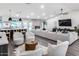Bright and airy living room featuring a fireplace and a modern, neutral-toned decor at 5975 E Larkspur Dr, Scottsdale, AZ 85254