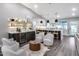Open-concept living area featuring a kitchen, wet bar, and comfortable seating at 5975 E Larkspur Dr, Scottsdale, AZ 85254