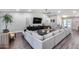 Inviting living space features vaulted ceilings, modern furniture, and a sleek entertainment setup at 5975 E Larkspur Dr, Scottsdale, AZ 85254