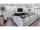 Comfortable living room with a large sectional sofa and contemporary decor at 5975 E Larkspur Dr, Scottsdale, AZ 85254