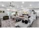 Bright, open-concept living and dining area featuring a large sectional and modern decor at 5975 E Larkspur Dr, Scottsdale, AZ 85254
