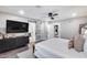 Contemporary main bedroom with an en-suite bathroom and a large television at 5975 E Larkspur Dr, Scottsdale, AZ 85254