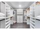 Large walk-in closet with custom built-in shelving and plenty of storage at 5975 E Larkspur Dr, Scottsdale, AZ 85254