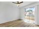 Bright bedroom showcasing hardwood floors, natural light, and sliding glass door offering outdoor access at 6009 N 79Th St, Scottsdale, AZ 85250