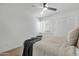 Bright bedroom with modern ceiling fan, window blinds, and mirrored closet doors providing ample storage at 6009 N 79Th St, Scottsdale, AZ 85250